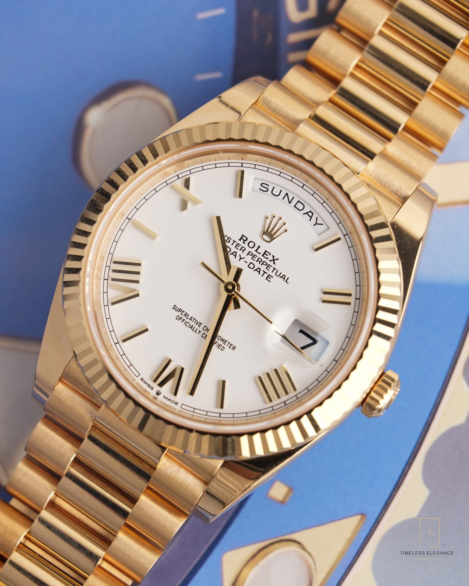 A yellow gold Rolex Day-Date on President bracelet, white dial with Roman numerals