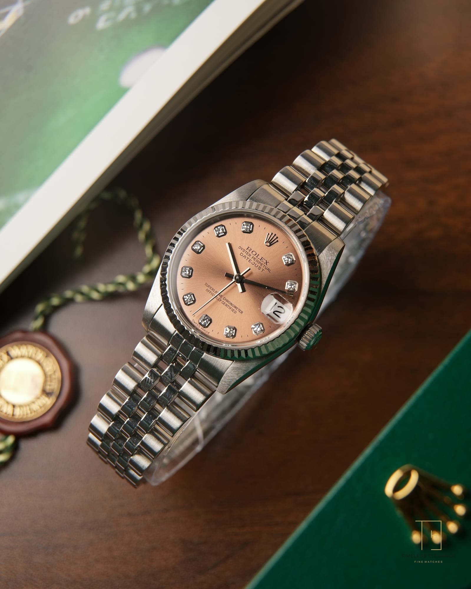 A Rolex Datejust with a rosé diamond dial and fluted bezel on a Jubilee bracelet