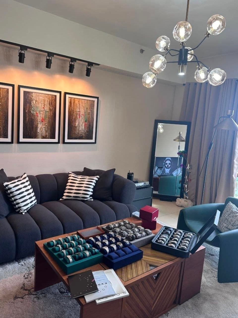 The Timeless Elegance lounge with trays of watches on the table